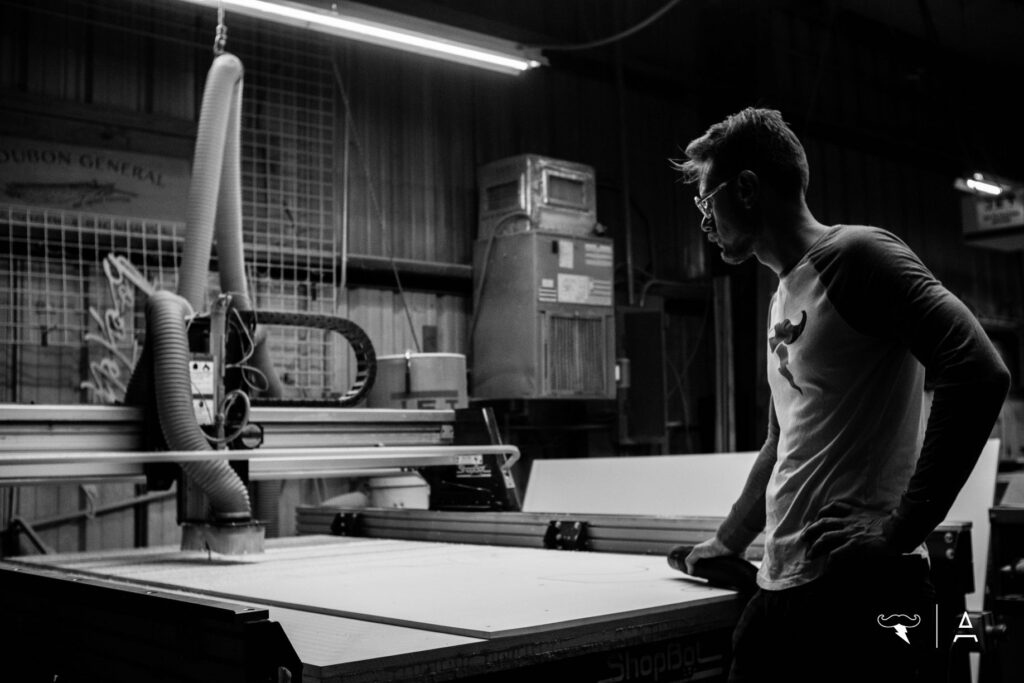 Josh at the CNC router — fabricating Heart Beacon