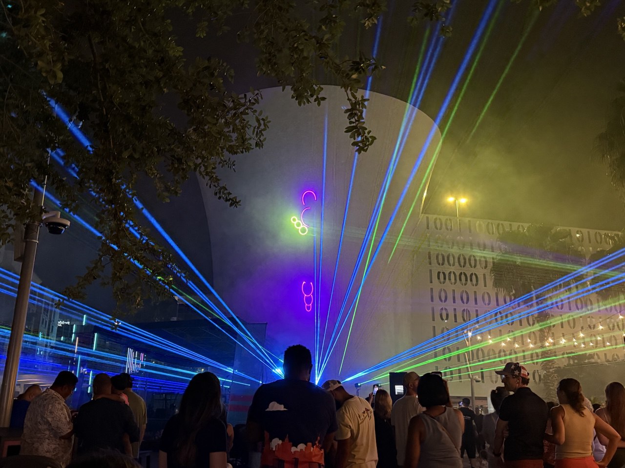 Blue and green beams fanning from the Beacon with purple laser graphics