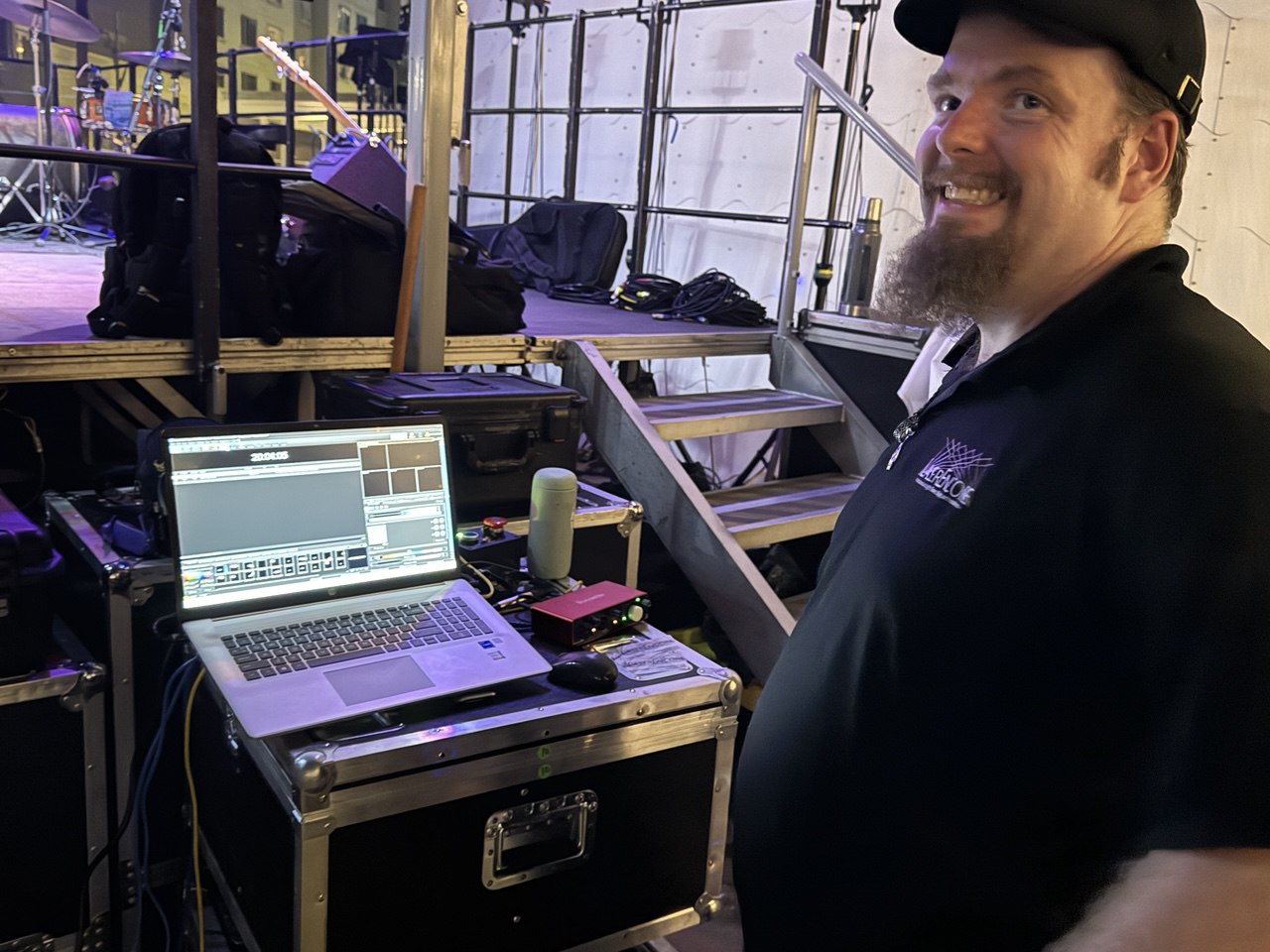 42 AV team member at the laser control station backstage