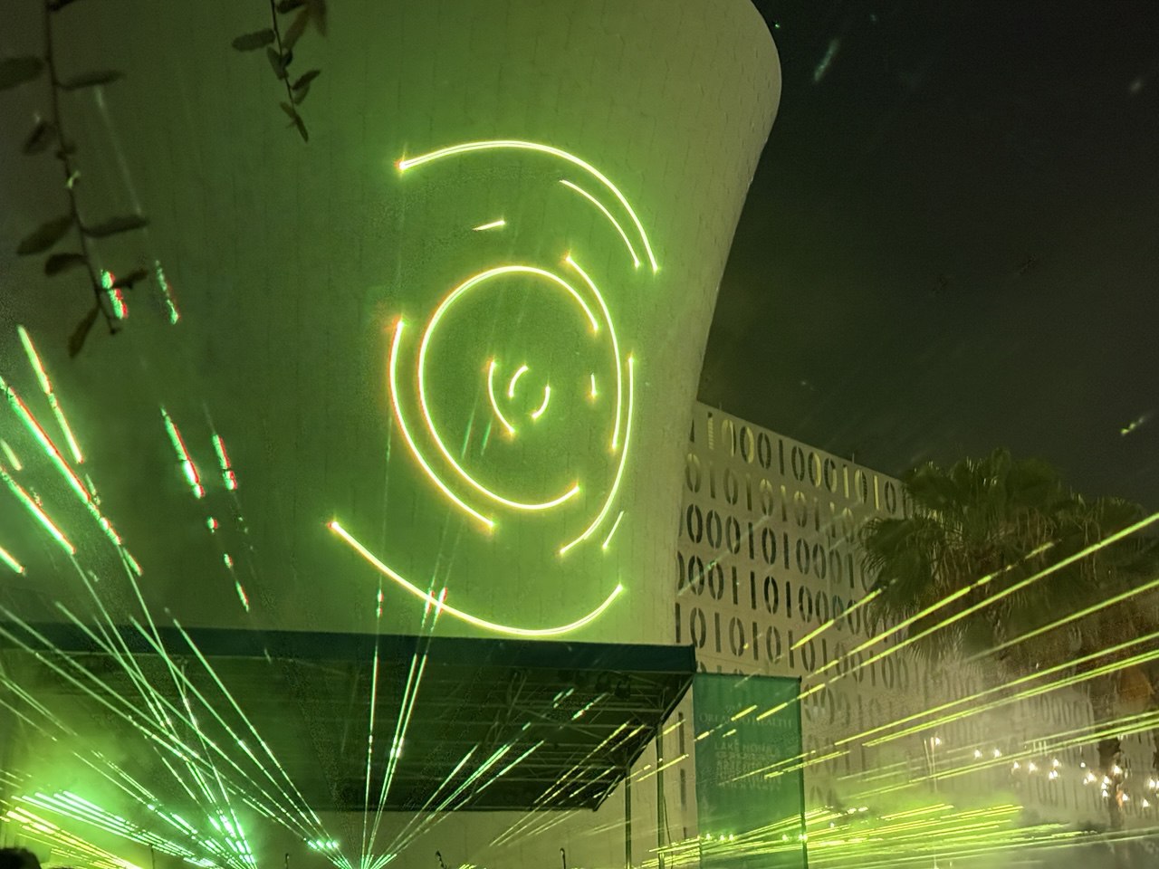 Green spirograph laser graphic projected onto the Beacon water tower