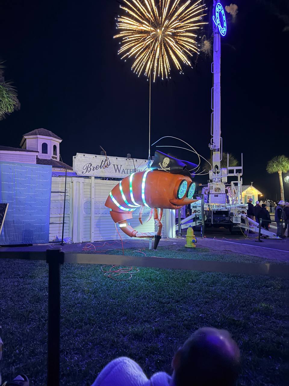 Shrimpy in the air with fireworks exploding behind