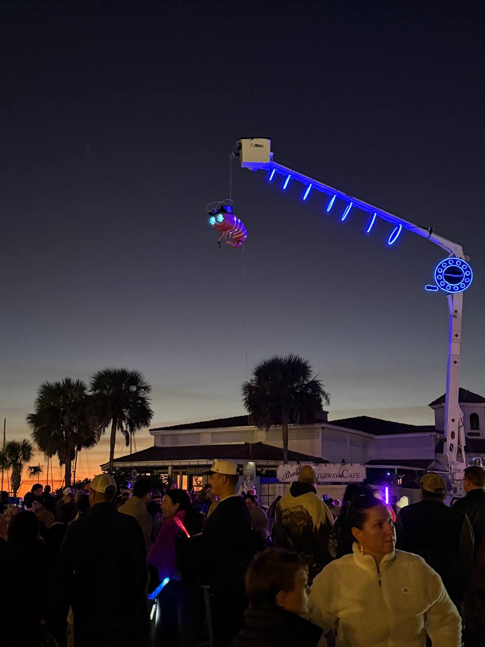 Shrimpy high on the crane at dusk with massive crowd below