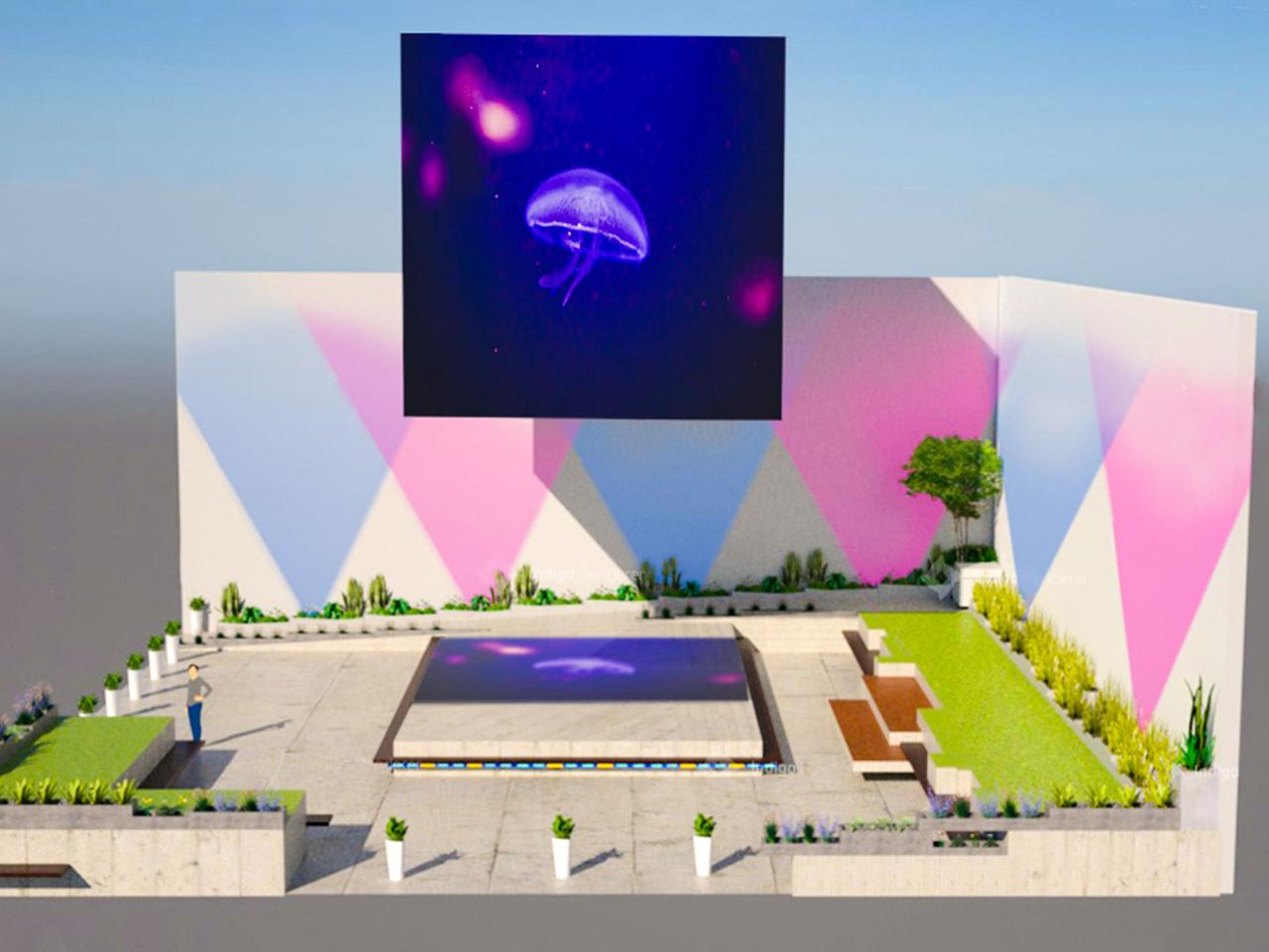 theCube displaying jellyfish art with pink light wash on adjacent buildings