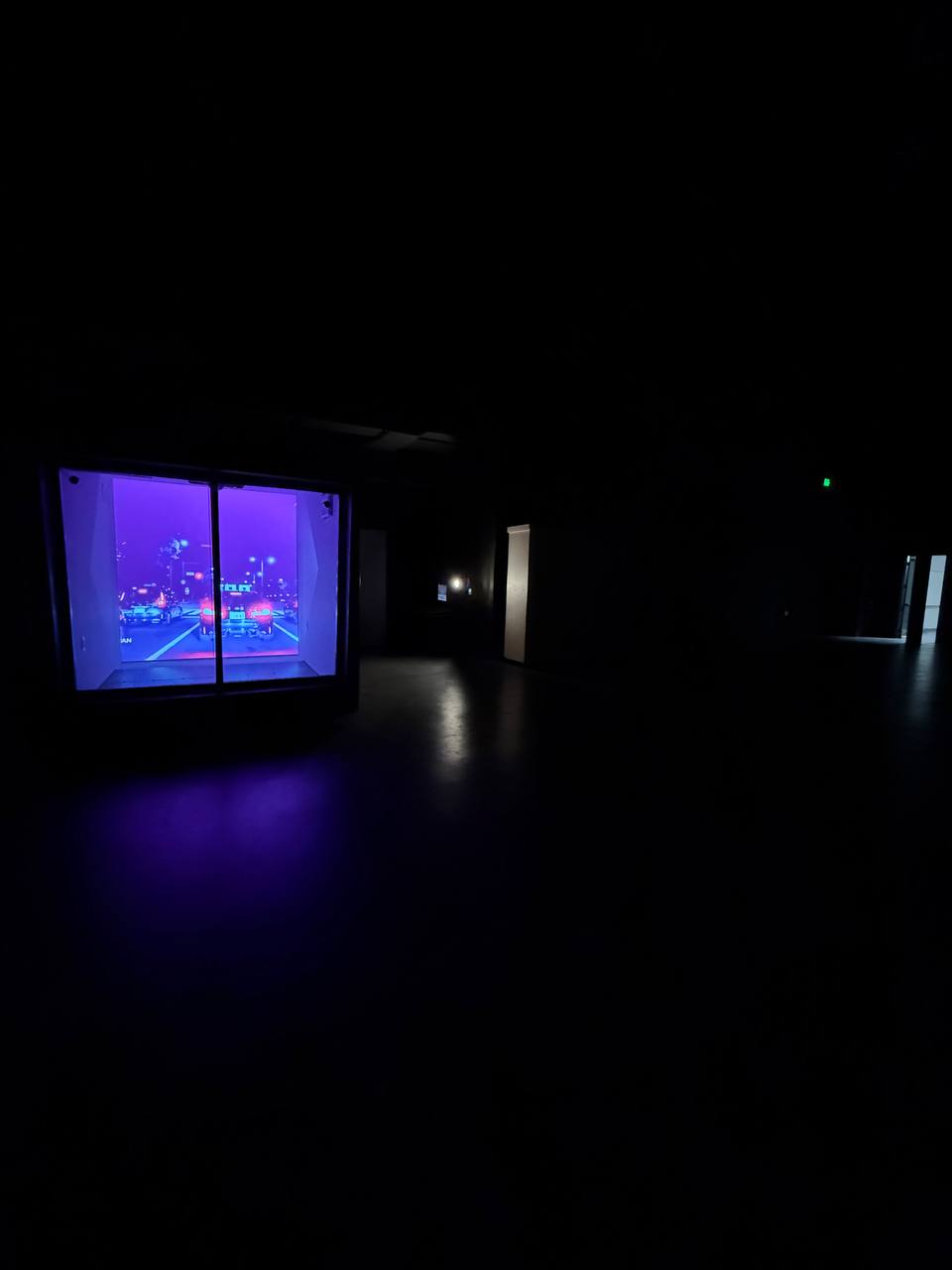 ArtCube glowing vivid purple in a darkened space — UCF build