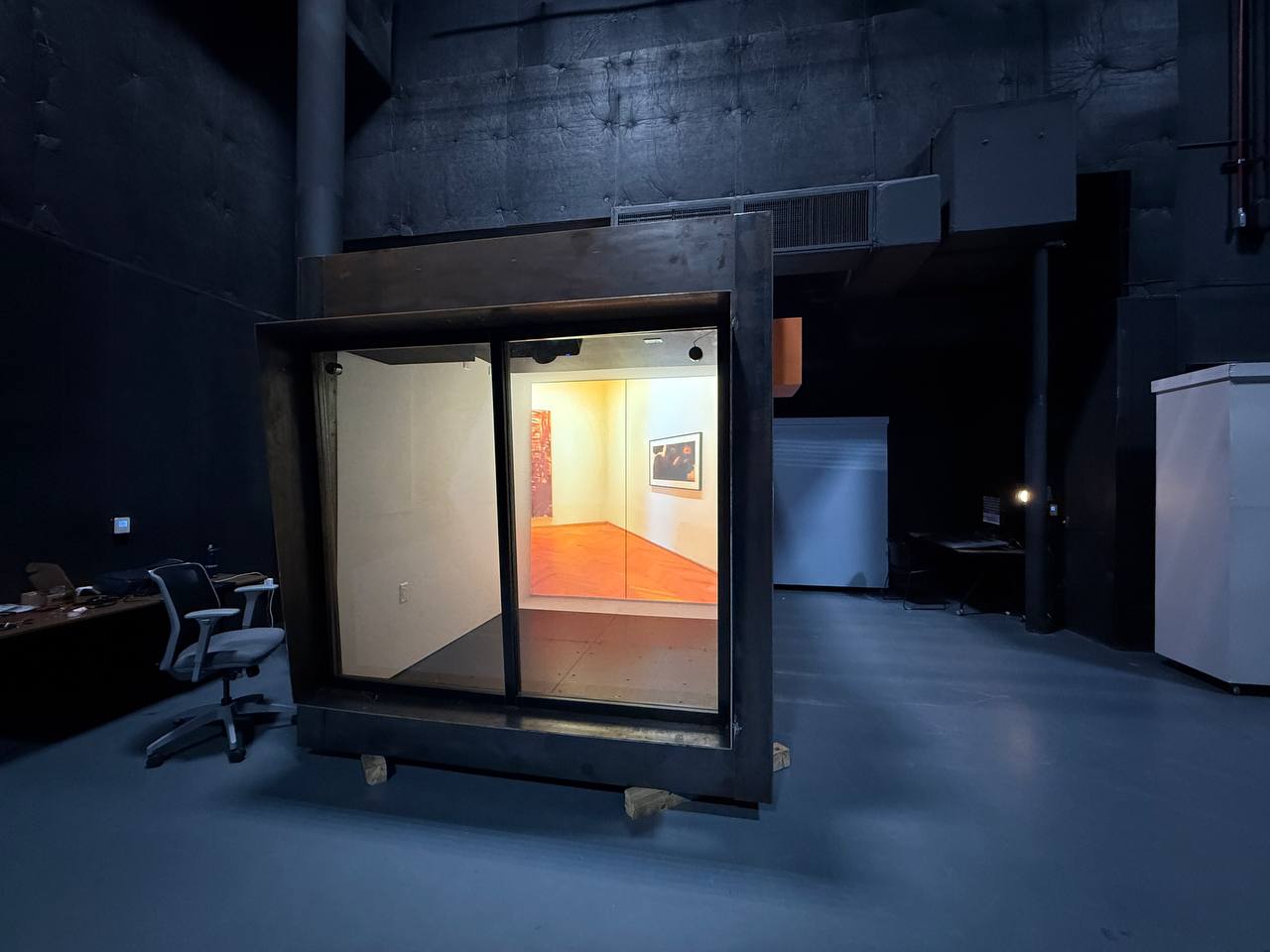 ArtCube interior configured as a white-cube gallery with framed artwork