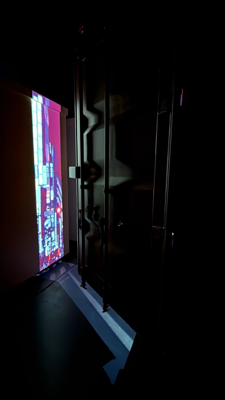 ArtCube interior with vivid magenta cityscape projection