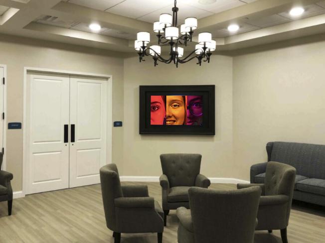 Palagio Senior Living sitting room with digital art display